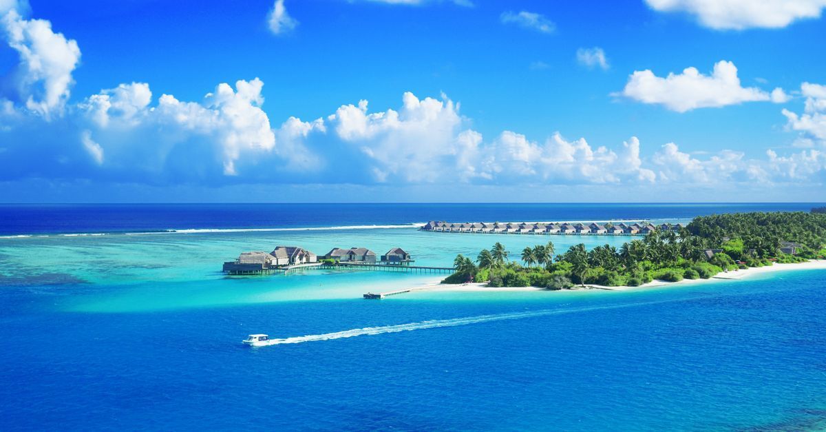 Maldives special occasion holiday with luxury beach dining and overwater villas