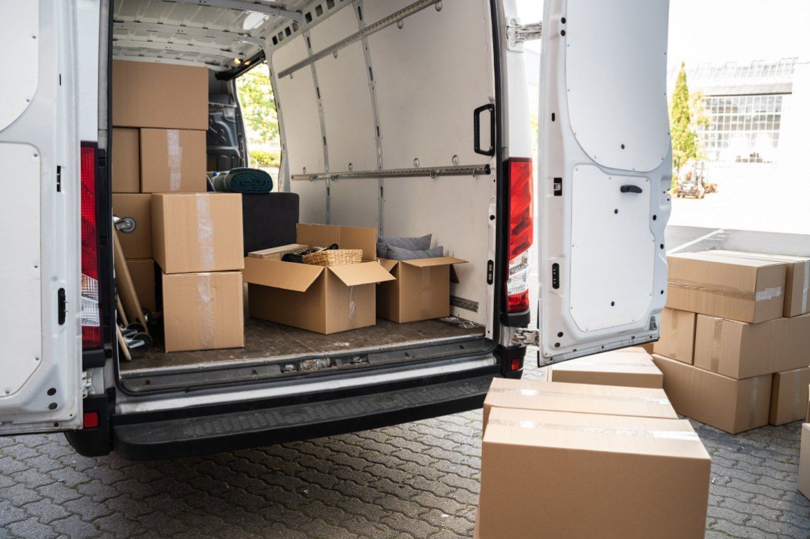 The Back of a Delivery Van is Filled With Cardboard Boxes — Buck Removals & Storage in Wagga Wagga, NSW