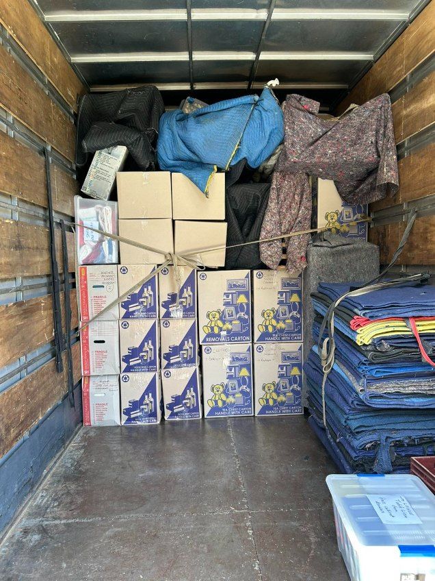 The Inside of a Moving Truck Filled With Boxes and Blankets — Buck Removals & Storage in Cowra, NSW