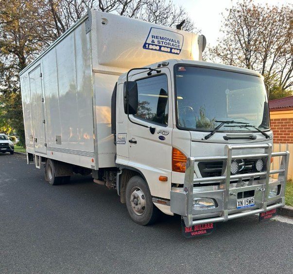 A White Moving Truck is Parked on the Side of the Road — Buck Removals & Storage in Wagga Wagga, NSW