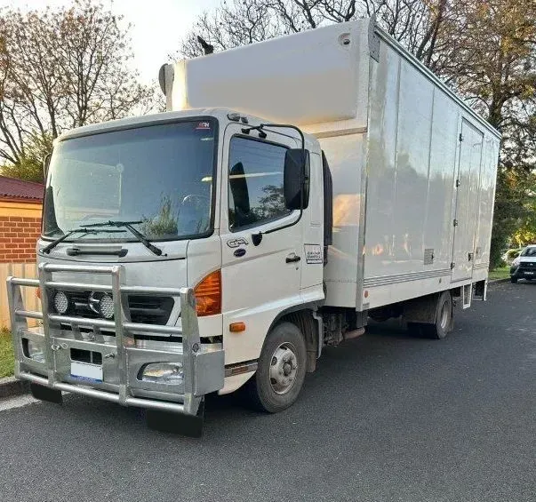 A White Truck is Parked on the Side of the Road — Buck Removals & Storage in Cowra, NSW