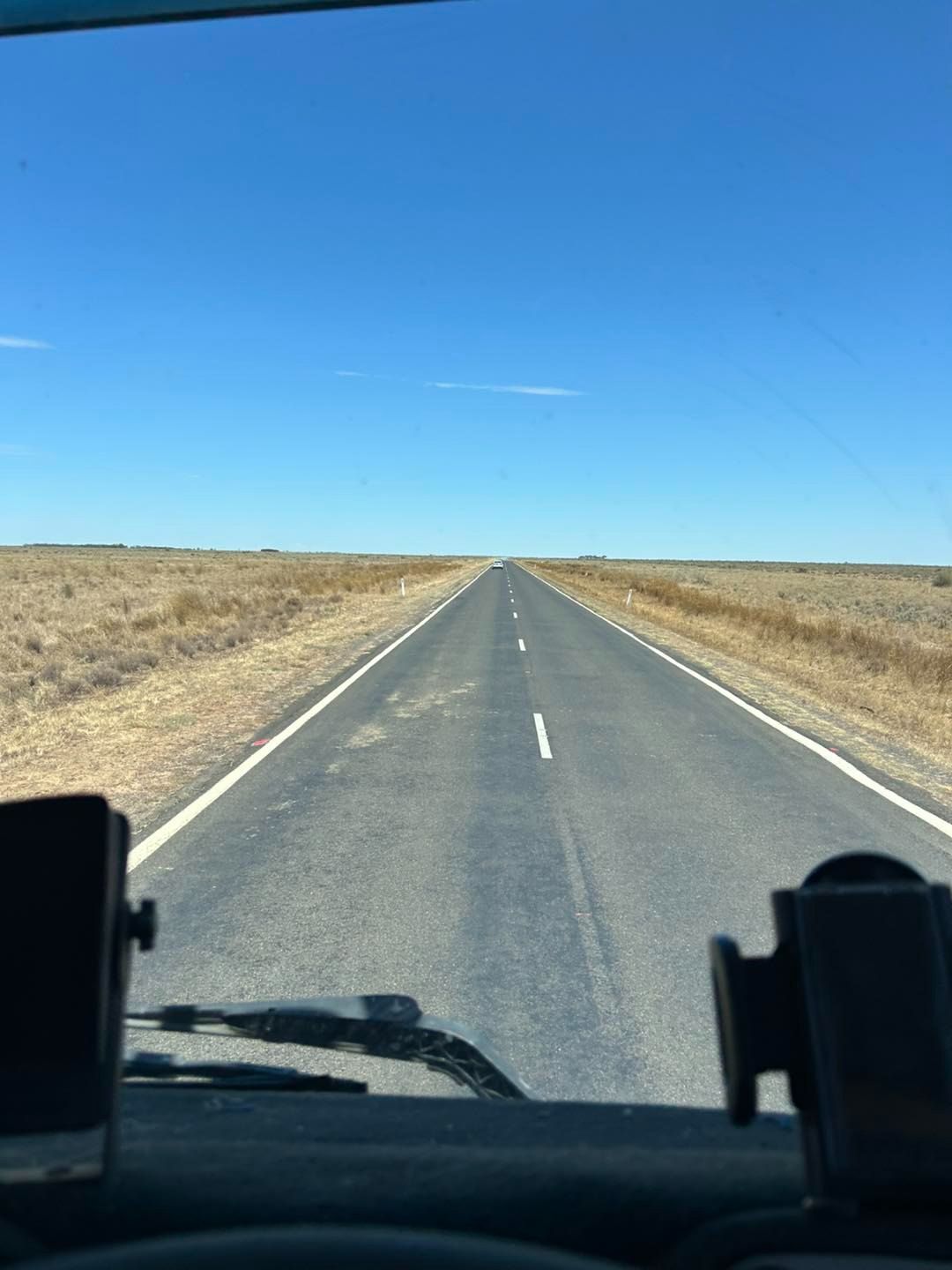 A View of an Empty Road From the Inside of a Car — Buck Removals & Storage in Parkes, NSW