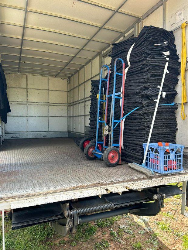 A Truck With a Stack of Blankets on the Back of It — Buck Removals & Storage in Young, NSW
