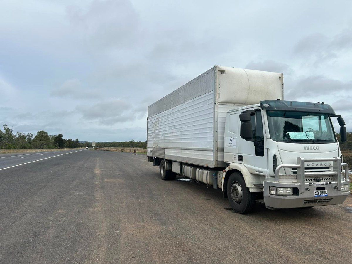A White Truck is Parked on the Side of the Road — Buck Removals & Storage in Orange, NSW