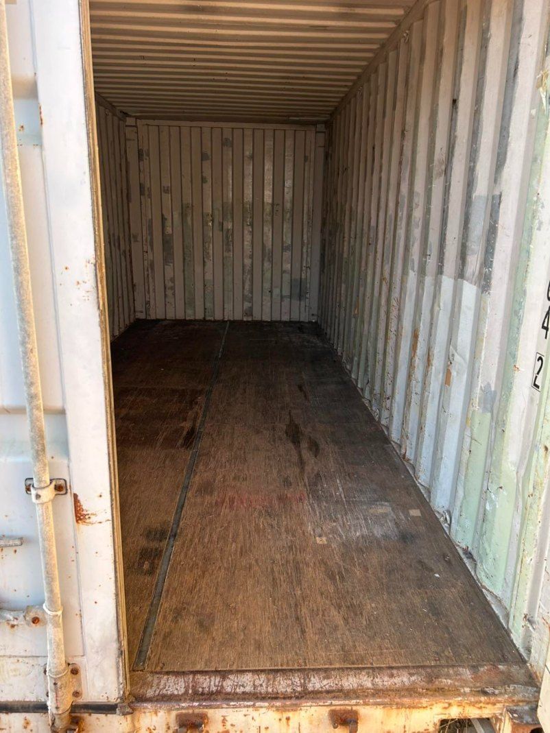 The Inside of a Shipping Container With a Wooden Floor — Buck Removals & Storage in Parkes, NSW