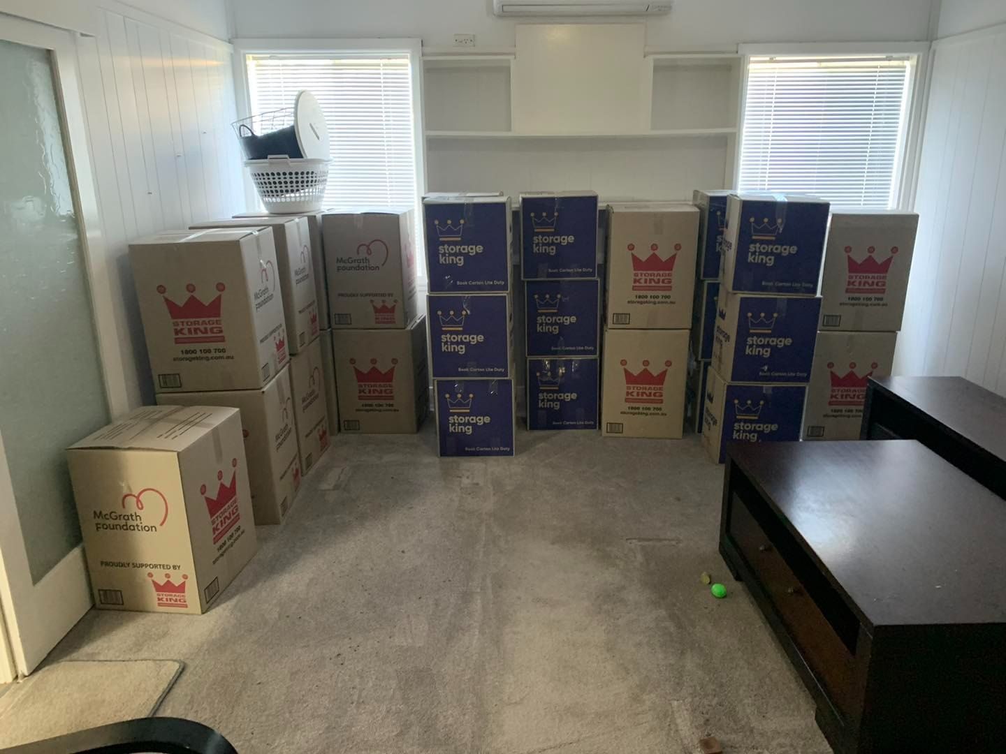 A Room Filled With Boxes With Crowns on Them — Buck Removals & Storage in Cowra, NSW