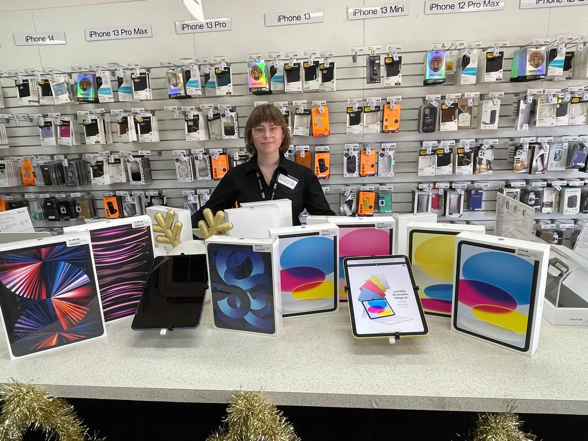 White Power Bank Charging a Tablet With a White and Gray Cable — Phone Hut in Alice Springs, NT