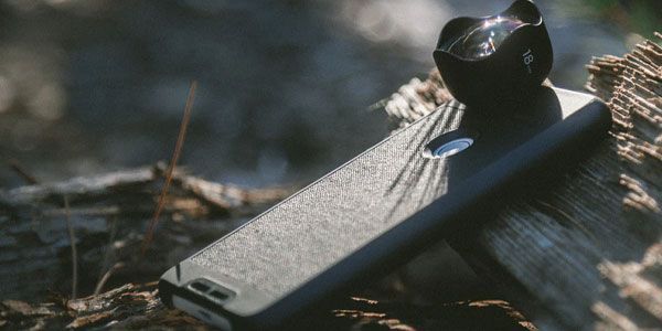 Person Plugging a Charging Cable Into a Black Smartphone — Phone Hut in Alice Springs, NT