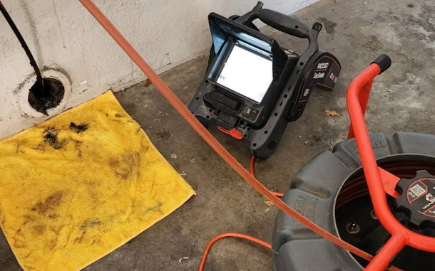 A person is using a camera to look at a pipe.