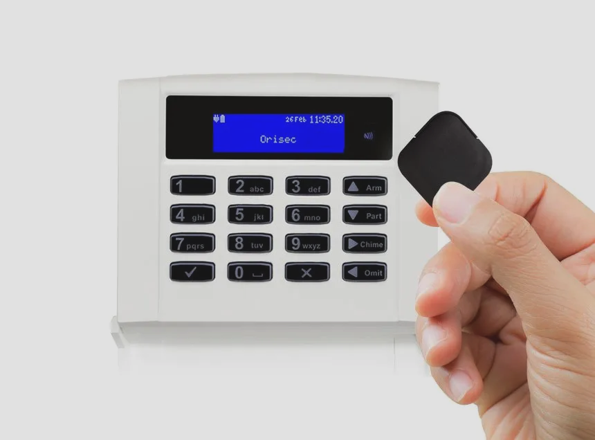 Intruder alarm keypad on interior wall