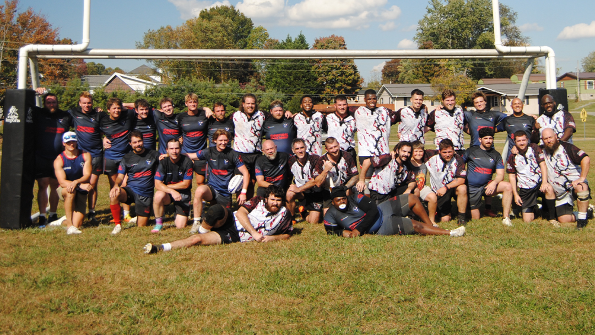 Men’s rugby team group photo on the field in Johnson City, Tennessee after a match