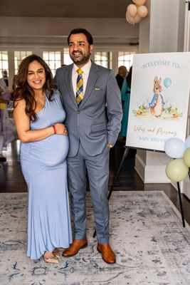 A photo of expectant couple smiling at Atlanta baby shower