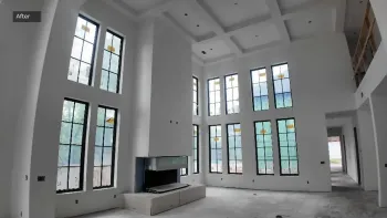 Project Odell great room in Bentonville, AR after drywall, with two-story window walls, fireplace chase, coffered ceiling