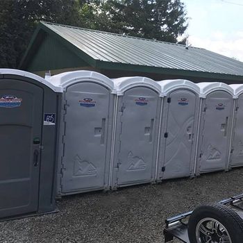 Grey and White Portable Toilets — Delaware, OH — Wells Septic & Drain Cleaning