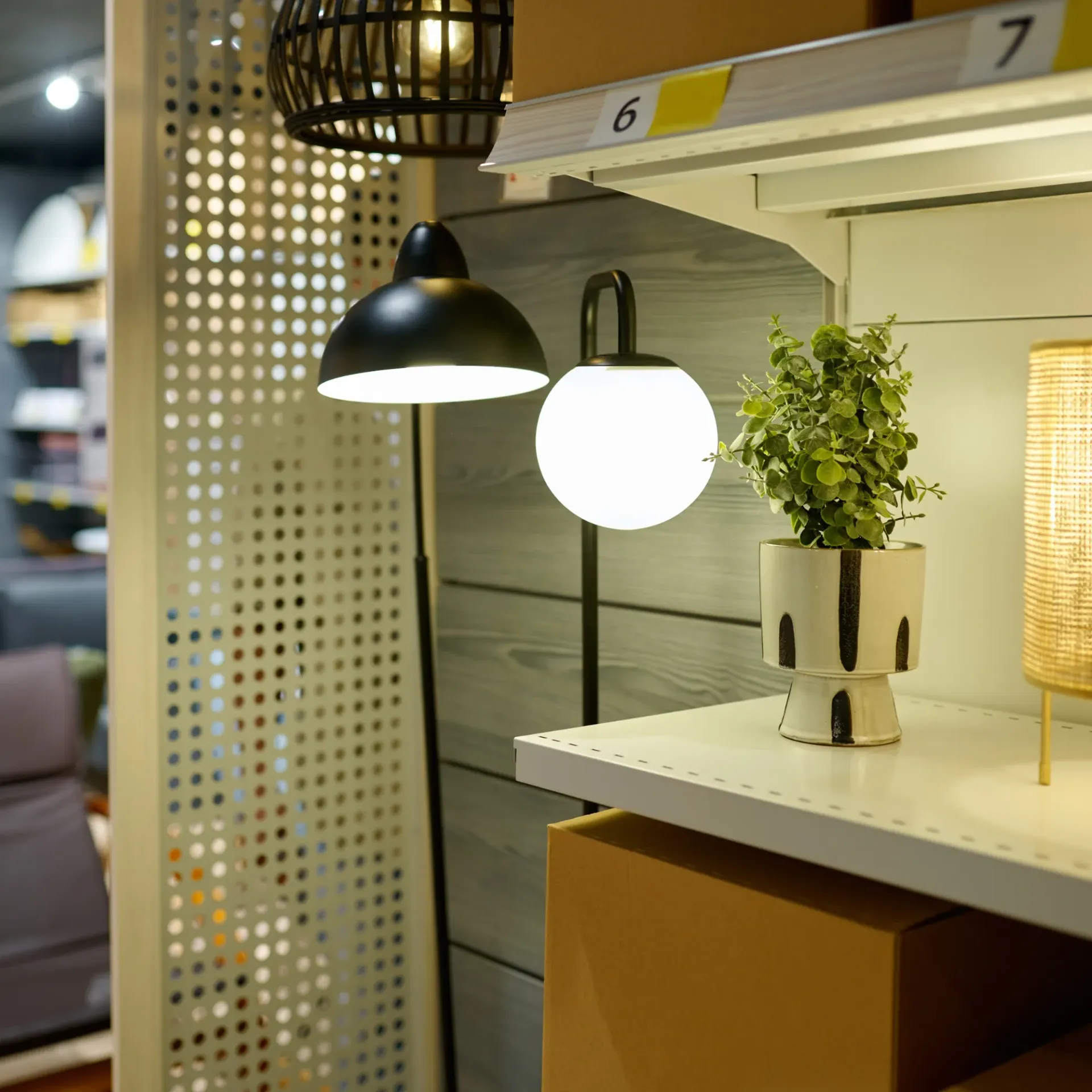 Sanchez Electric and Remodeling - A potted plant sits on a shelf next to a lamp
