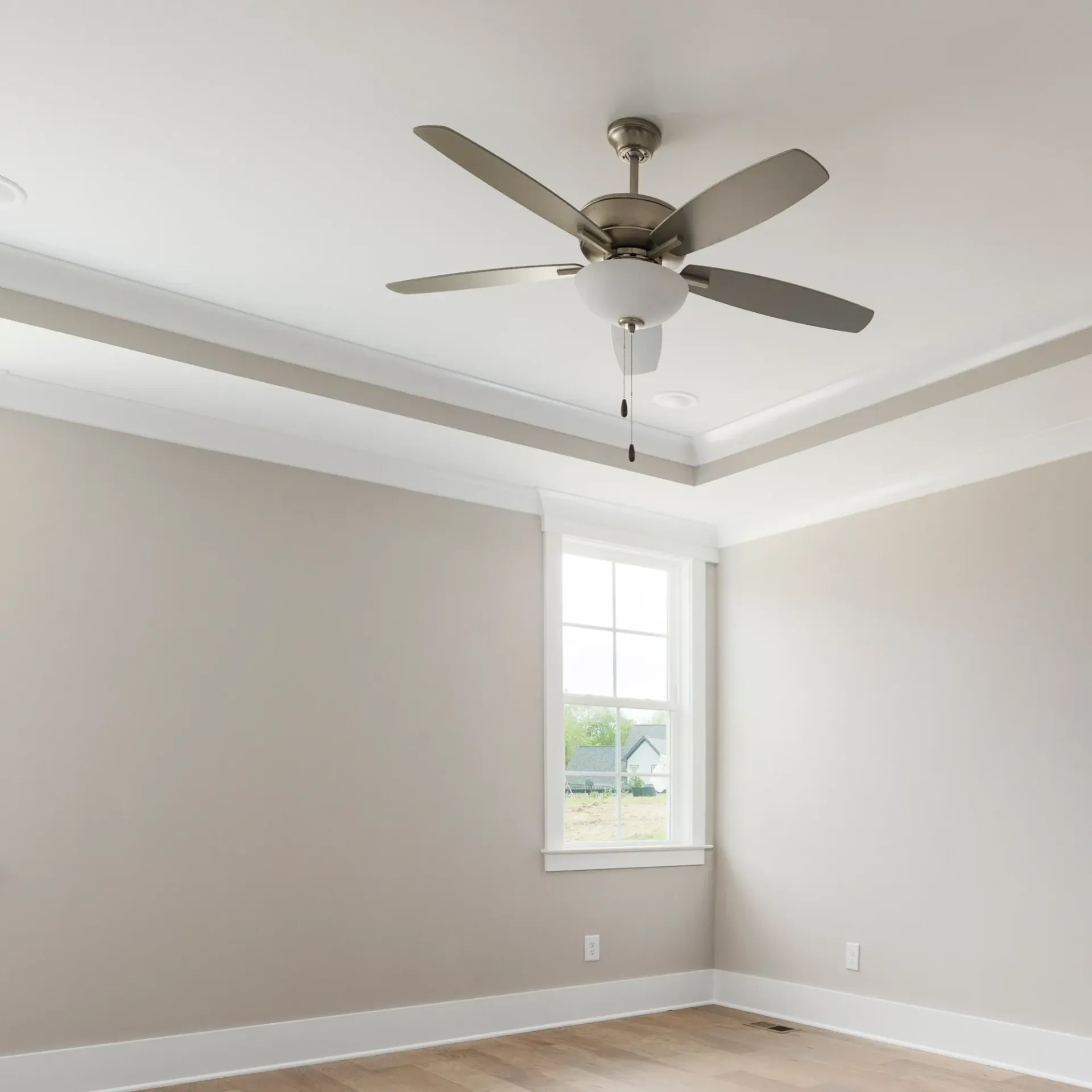 Sanchez Electric and Remodeling - An empty room with a ceiling fan and a window