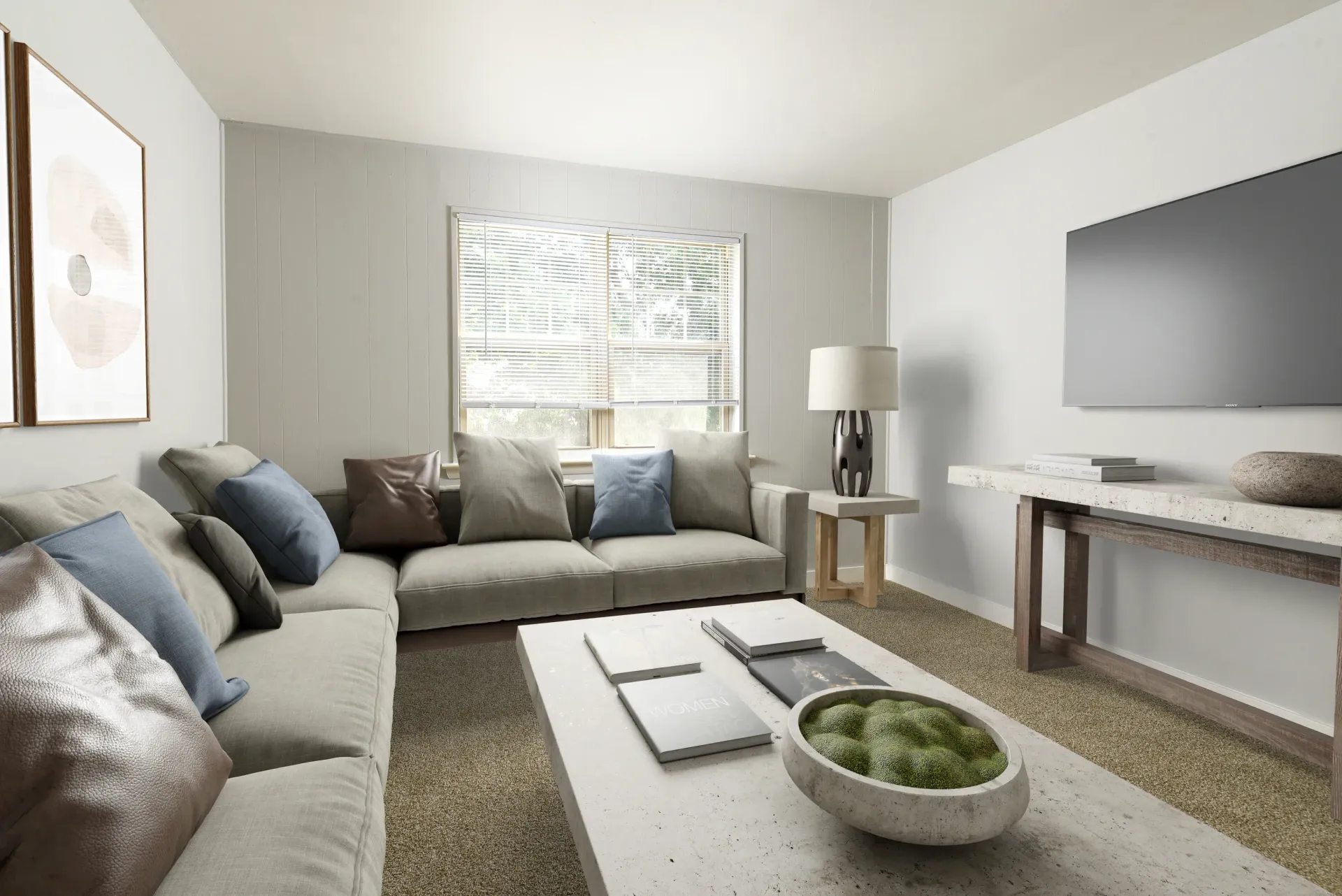 Living room with beige sectional sofa, coffee table, TV, and neutral decor.