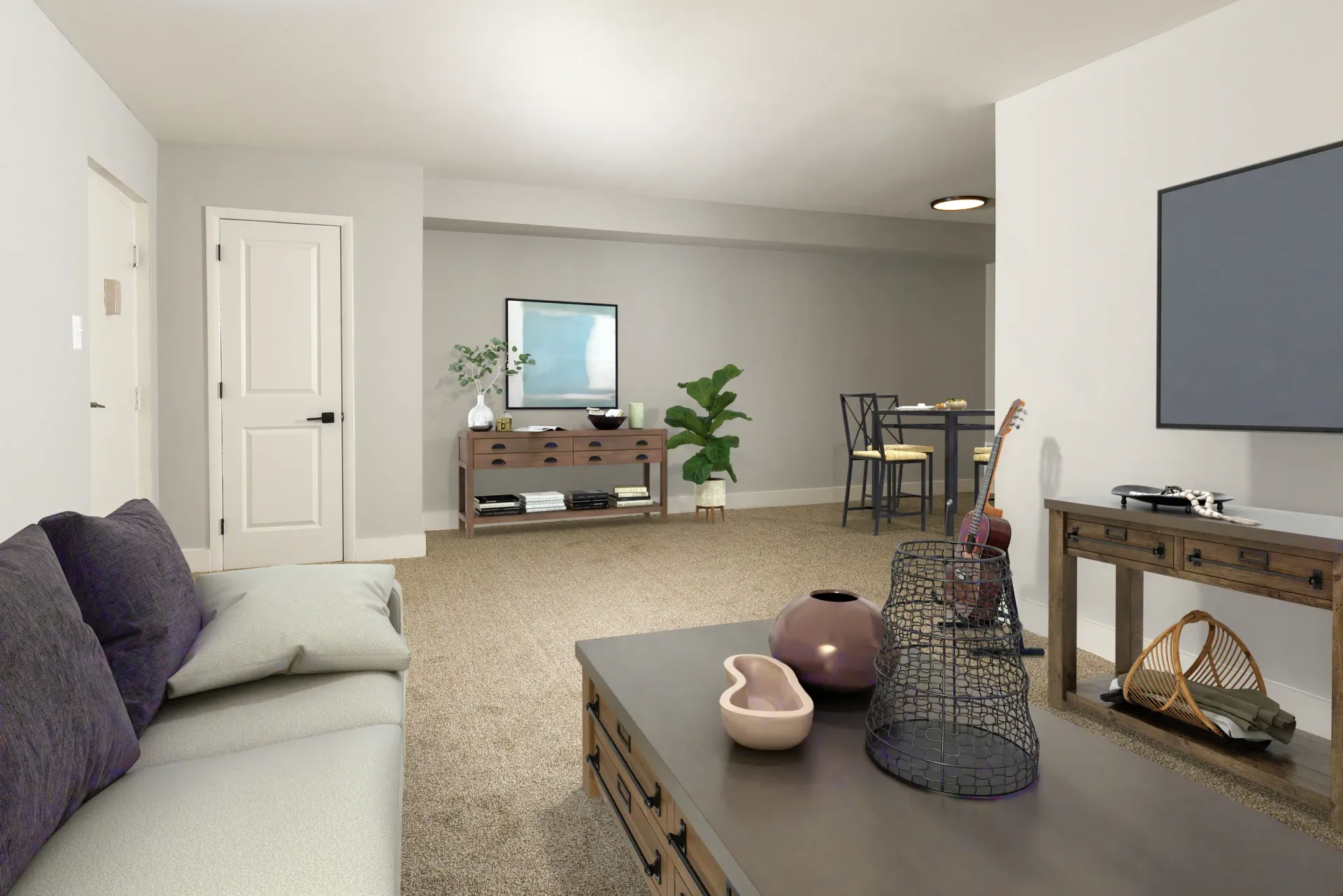 Living room in a furnished apartment with a sofa, coffee table, and TV console.