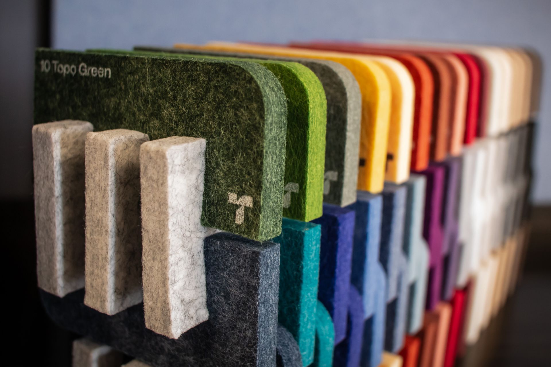 A bunch of different colored pieces of foam are sitting on a table.