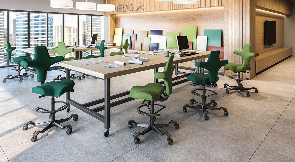 A room with a table and chairs in it