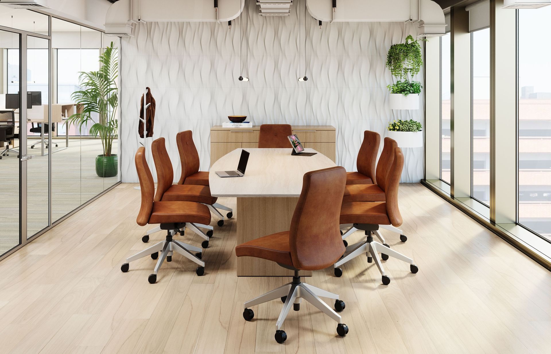 A conference room with a long table and chairs.