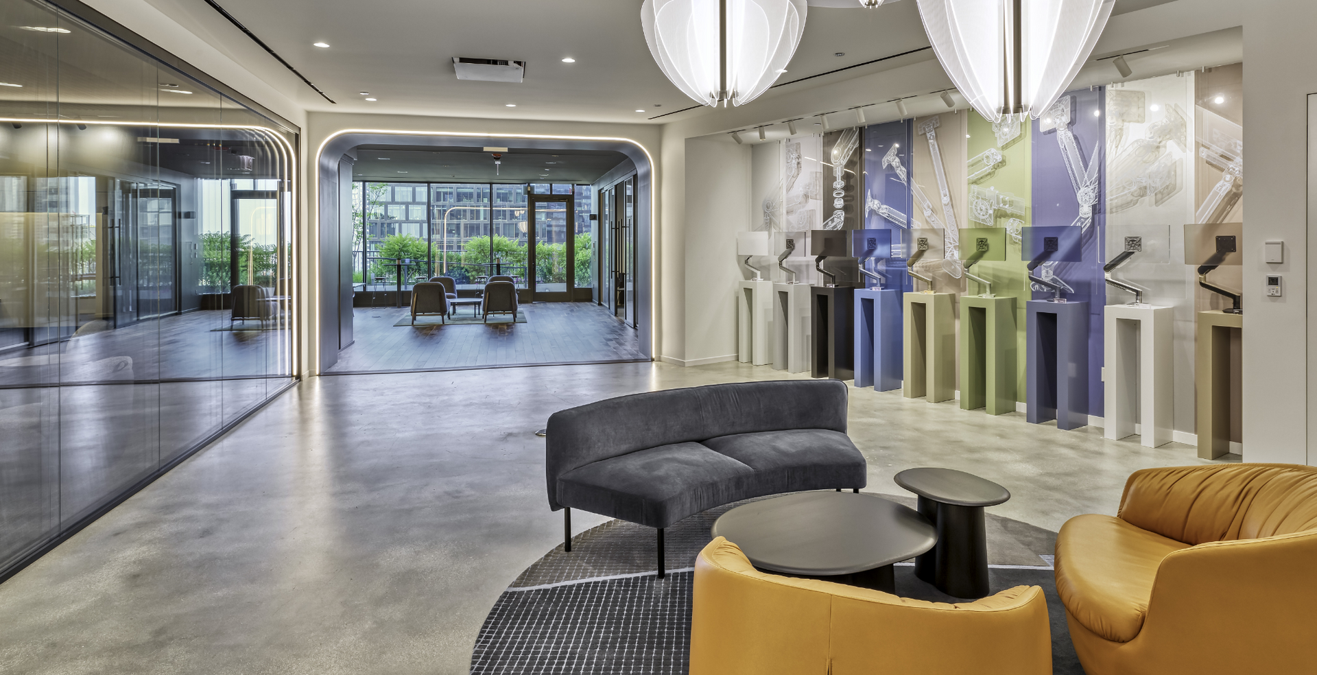 A living room with a couch , chairs and tables.