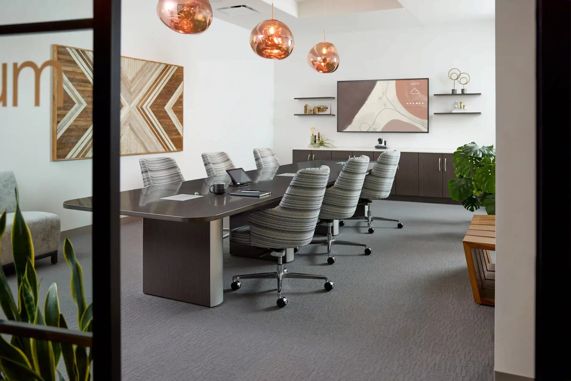 A conference room with a long table and chairs