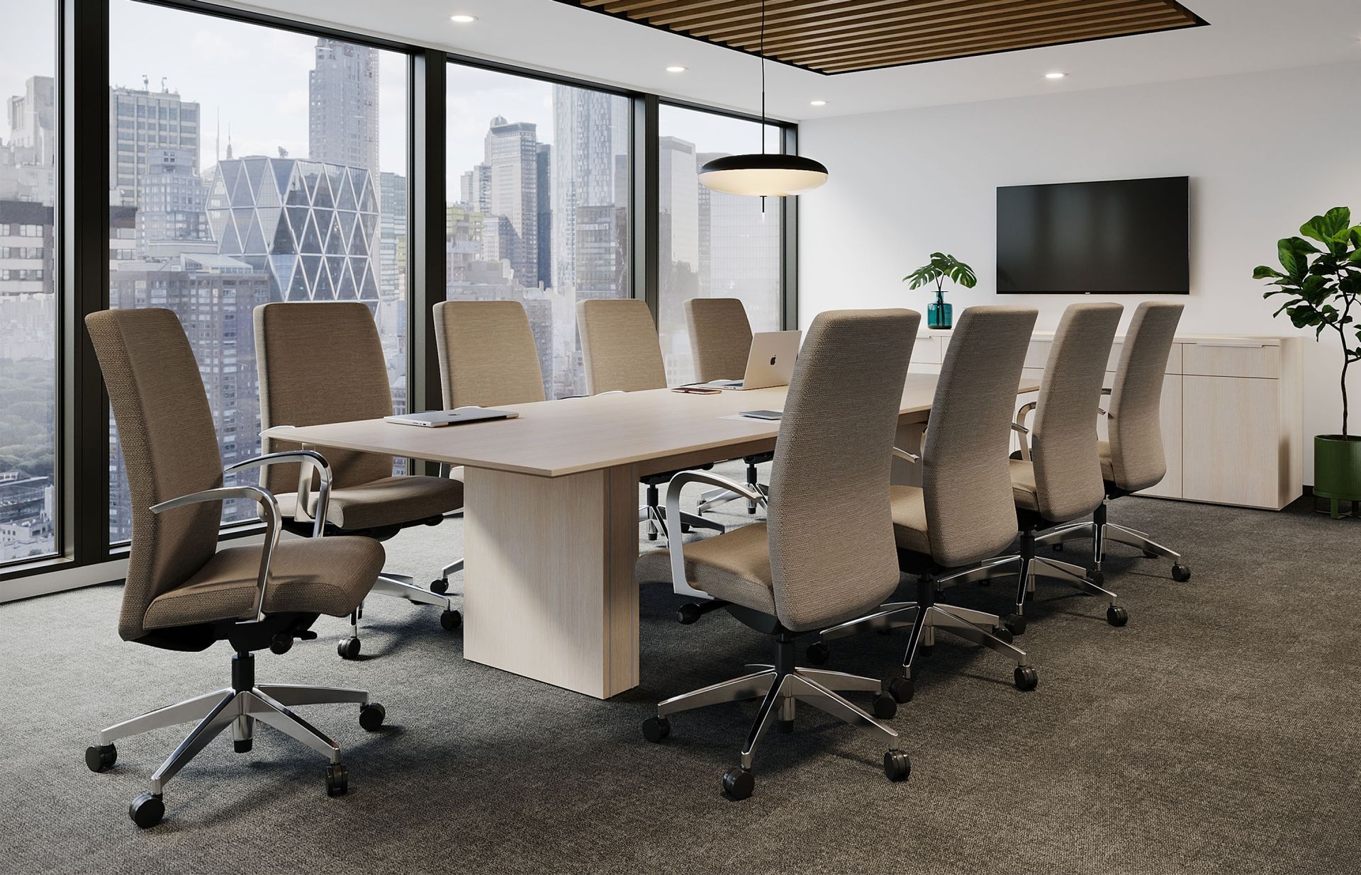 A conference room with a long table and chairs.