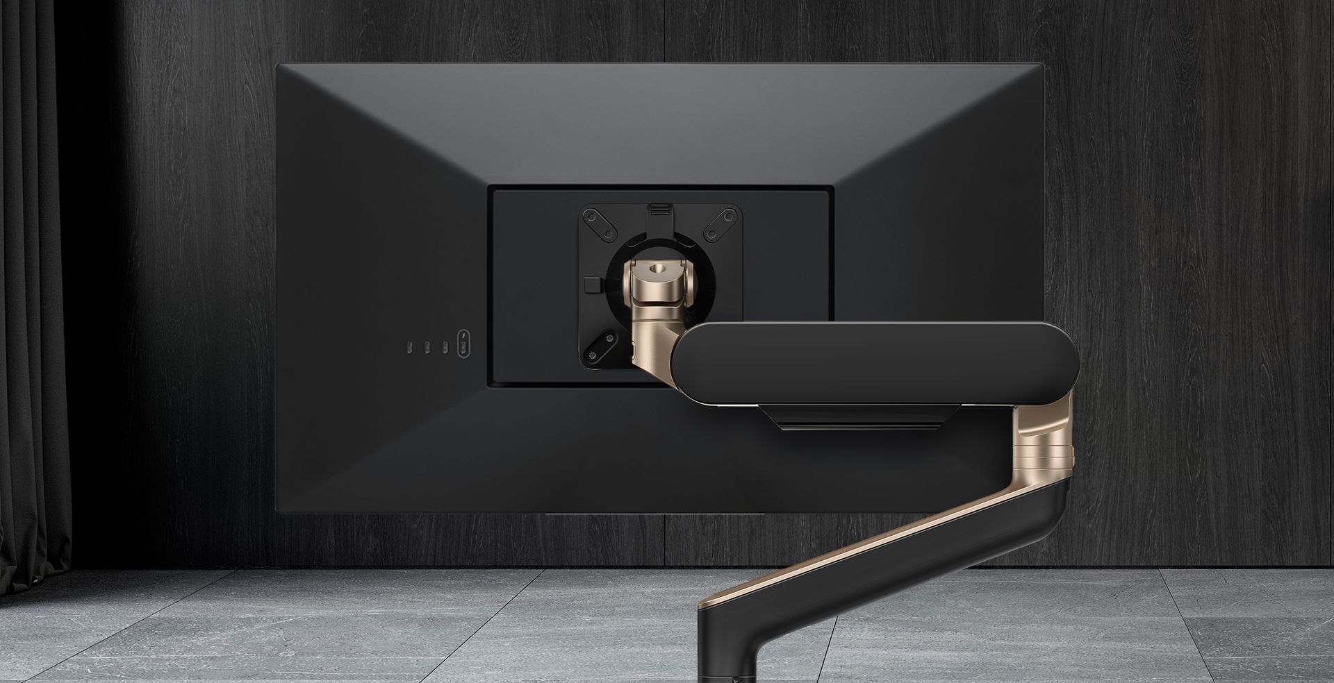 A computer monitor is sitting on a desk in a room.