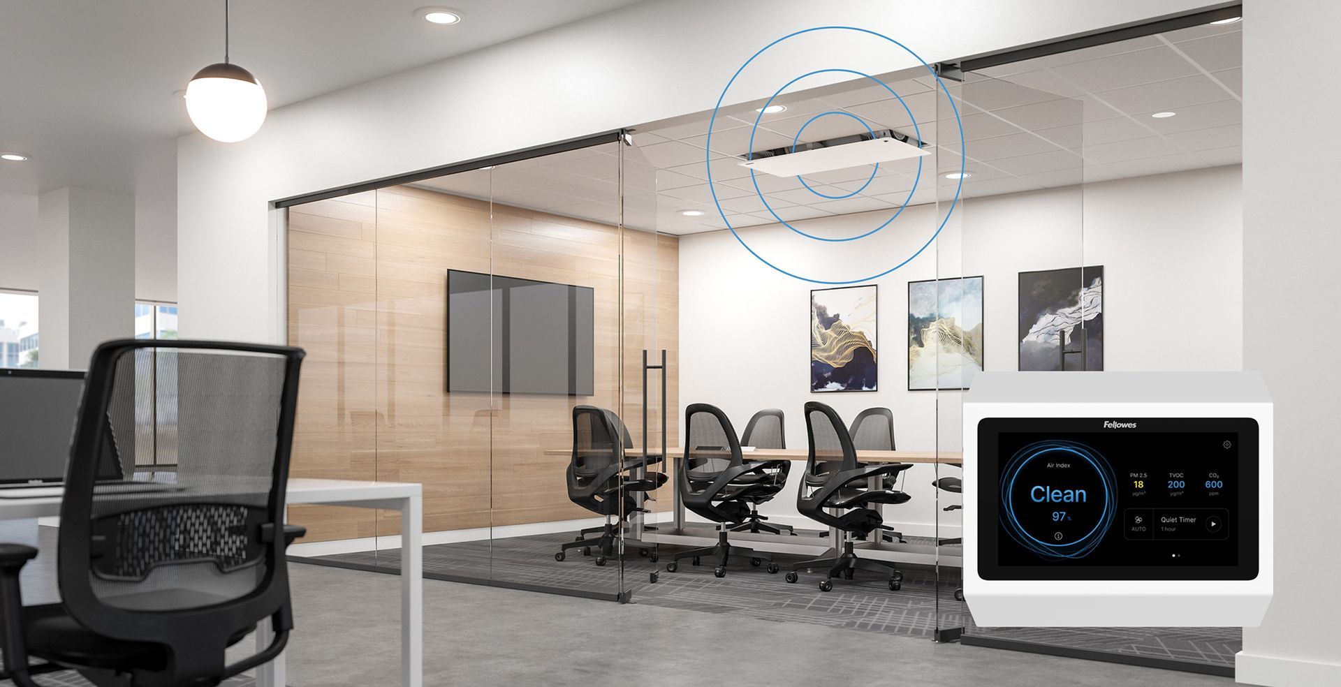 An office with a lot of chairs and tables and a thermostat on the wall.