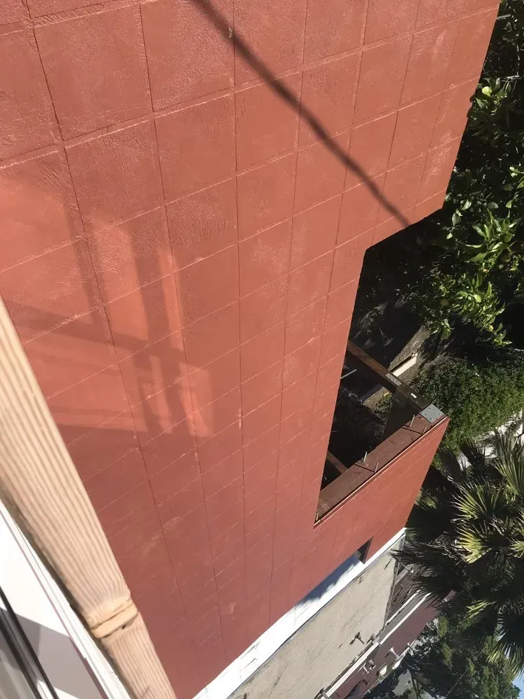 Red tiled roof with an angled cutaway, seen from above.