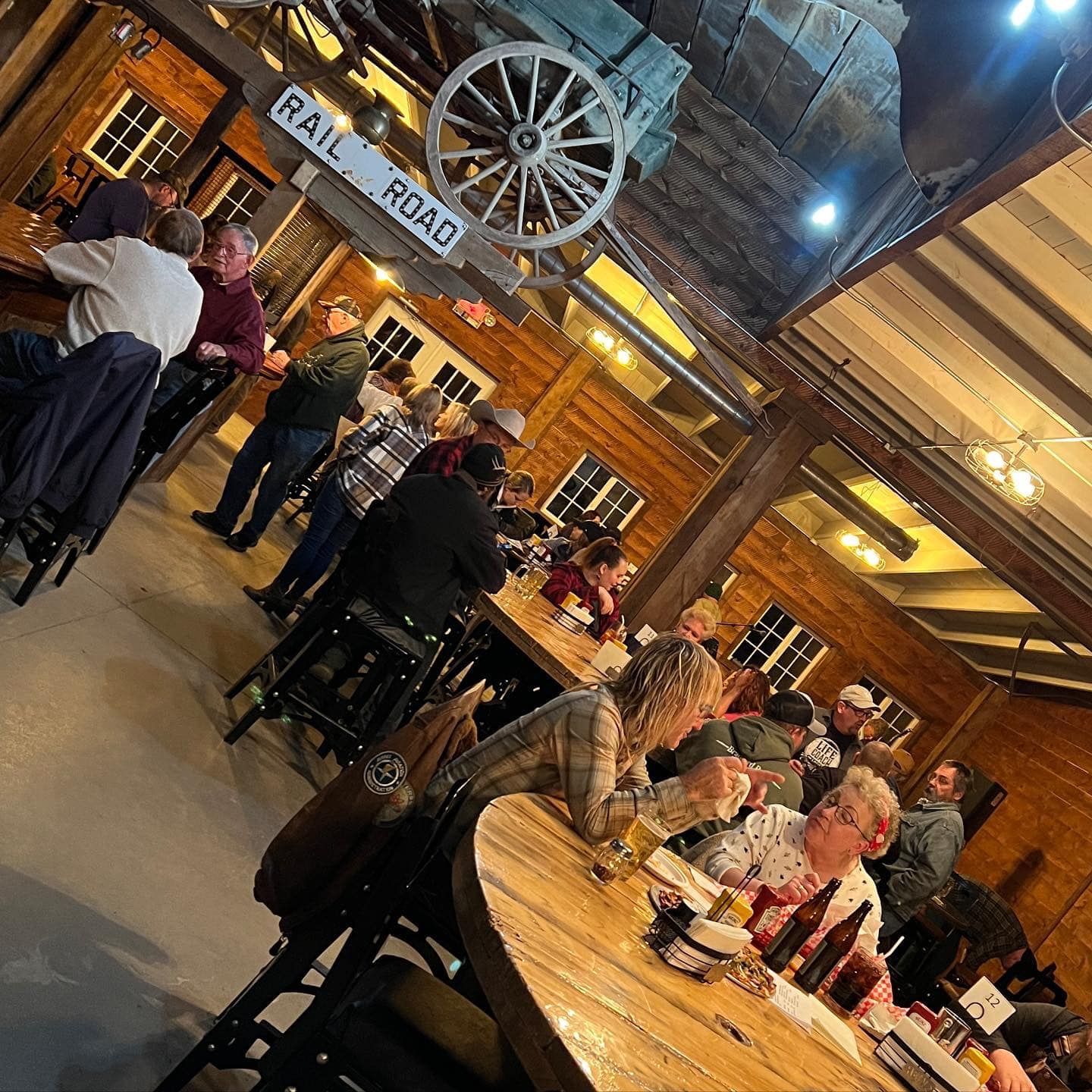 Wide angle view of customers at tables in The Brewery