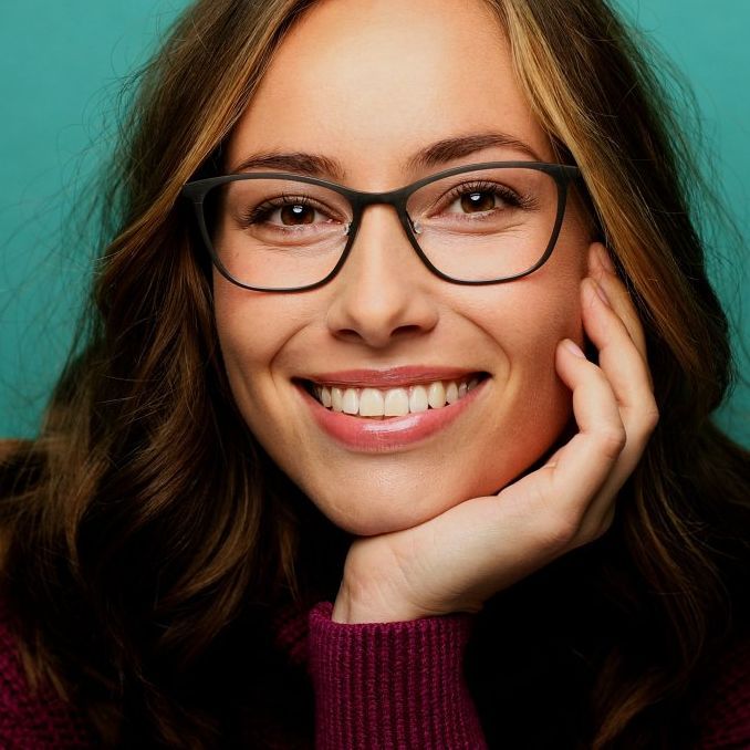 Woman with glasses, smiling