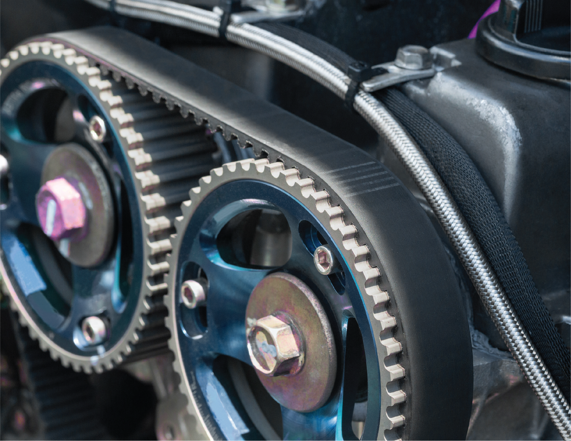 A close up of a timing belt on a car engine