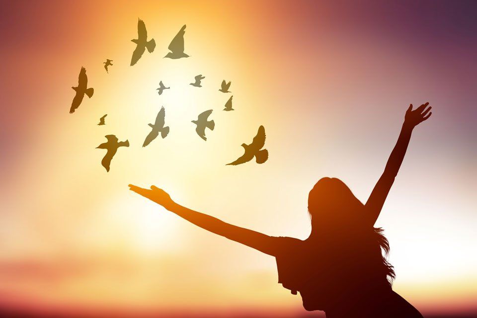 woman spreading arms