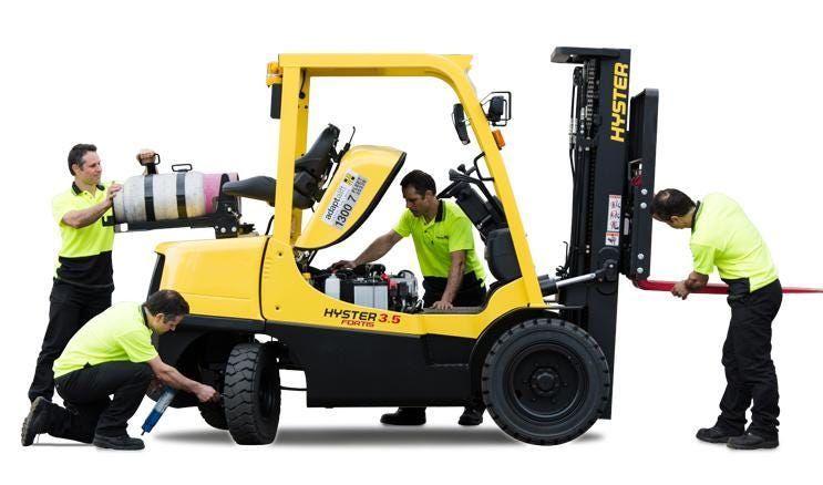 Technician Maintaining a Forklift