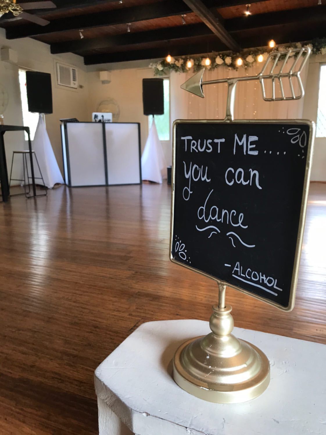 A chalkboard sign that says trust me you can dance