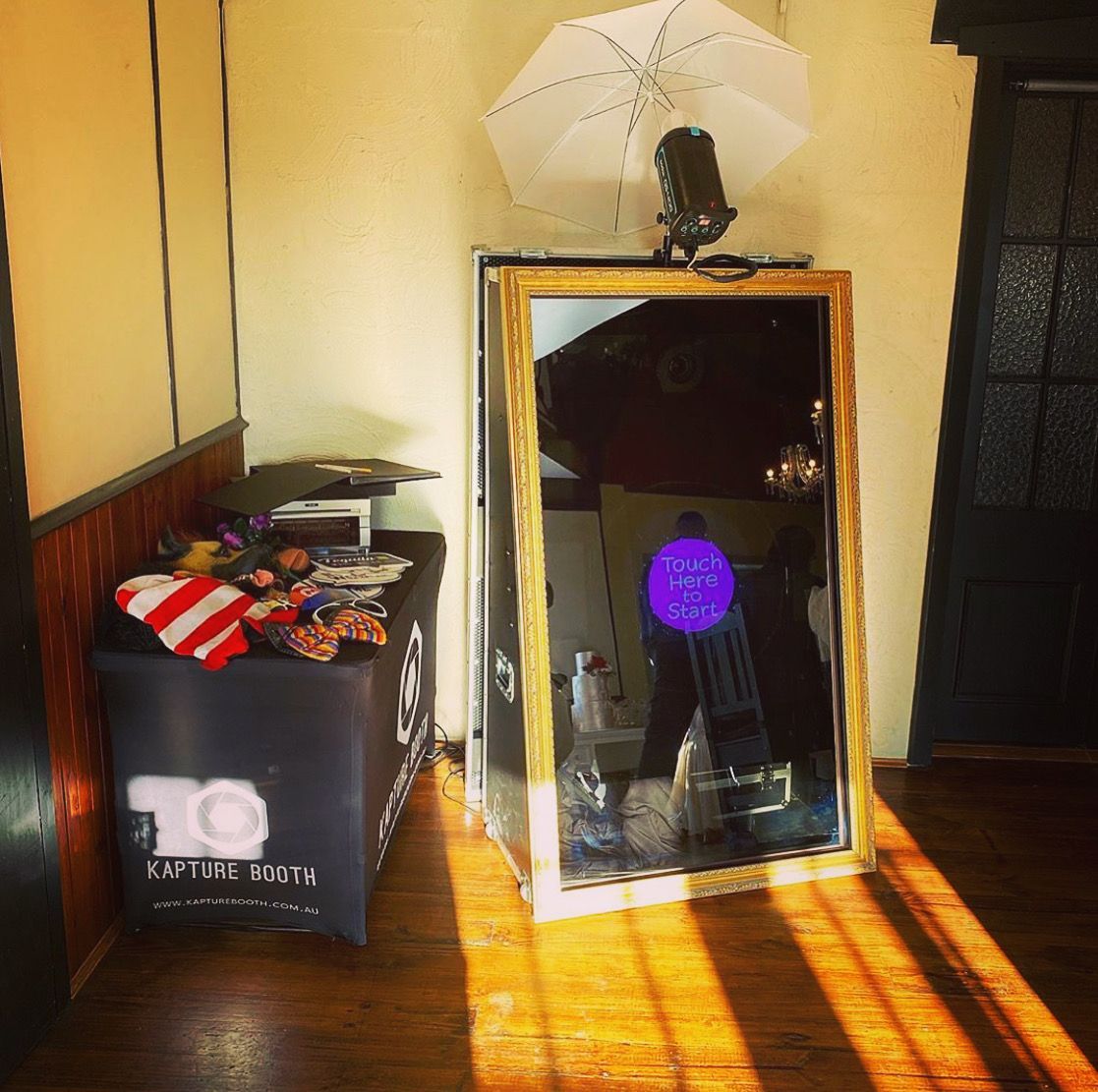 A mirror in a room with a box that says to on it