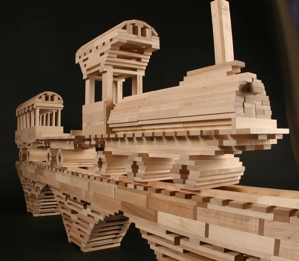 a model of a train made out of wooden blocks