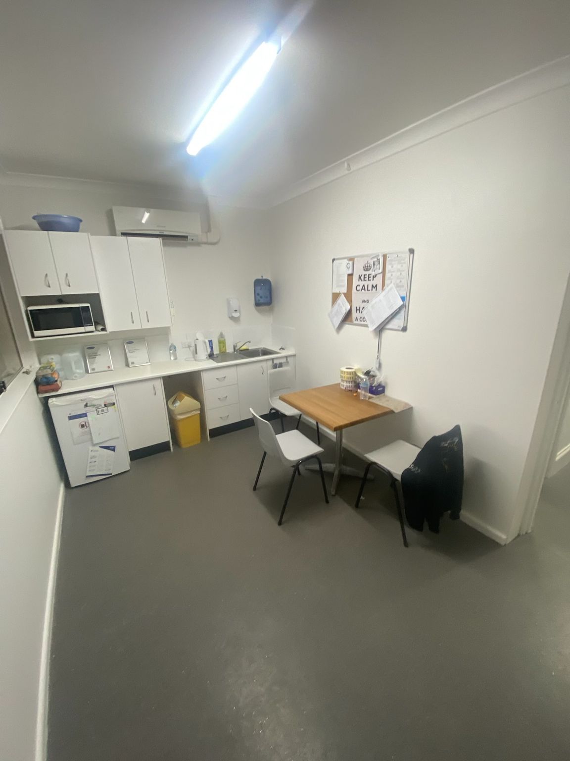 Small Office Break Room With Kitchenette, Table, and Two Chairs — Robert Seeliger Painter And Decorator in Narromine, NSW