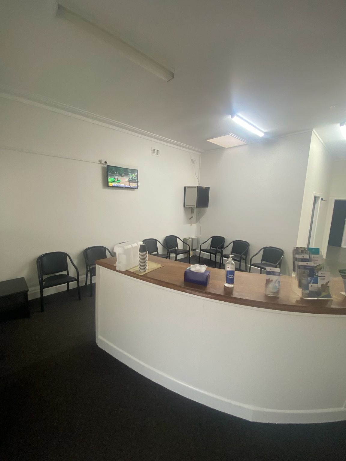 A Curved White Reception Desk in a Waiting Room — Robert Seeliger Painter & Decorator in Dubbo, NSW