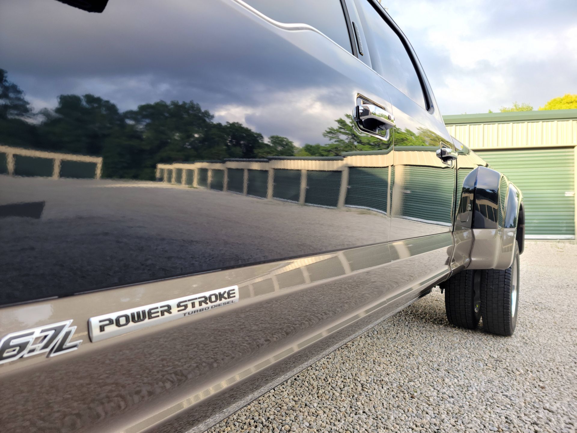 A black truck with a power stroke sticker on the side