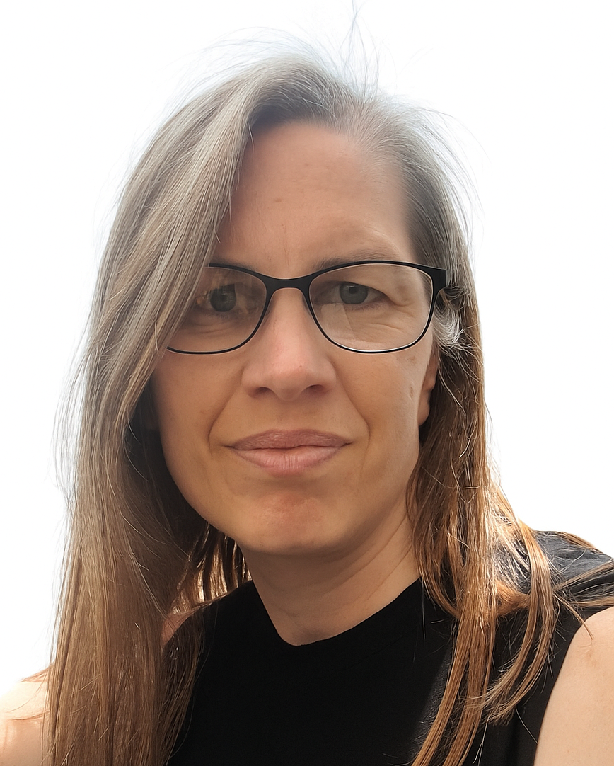 Jen is a white woman with glasses and straight brown hair that ends just below her shoulders. 
