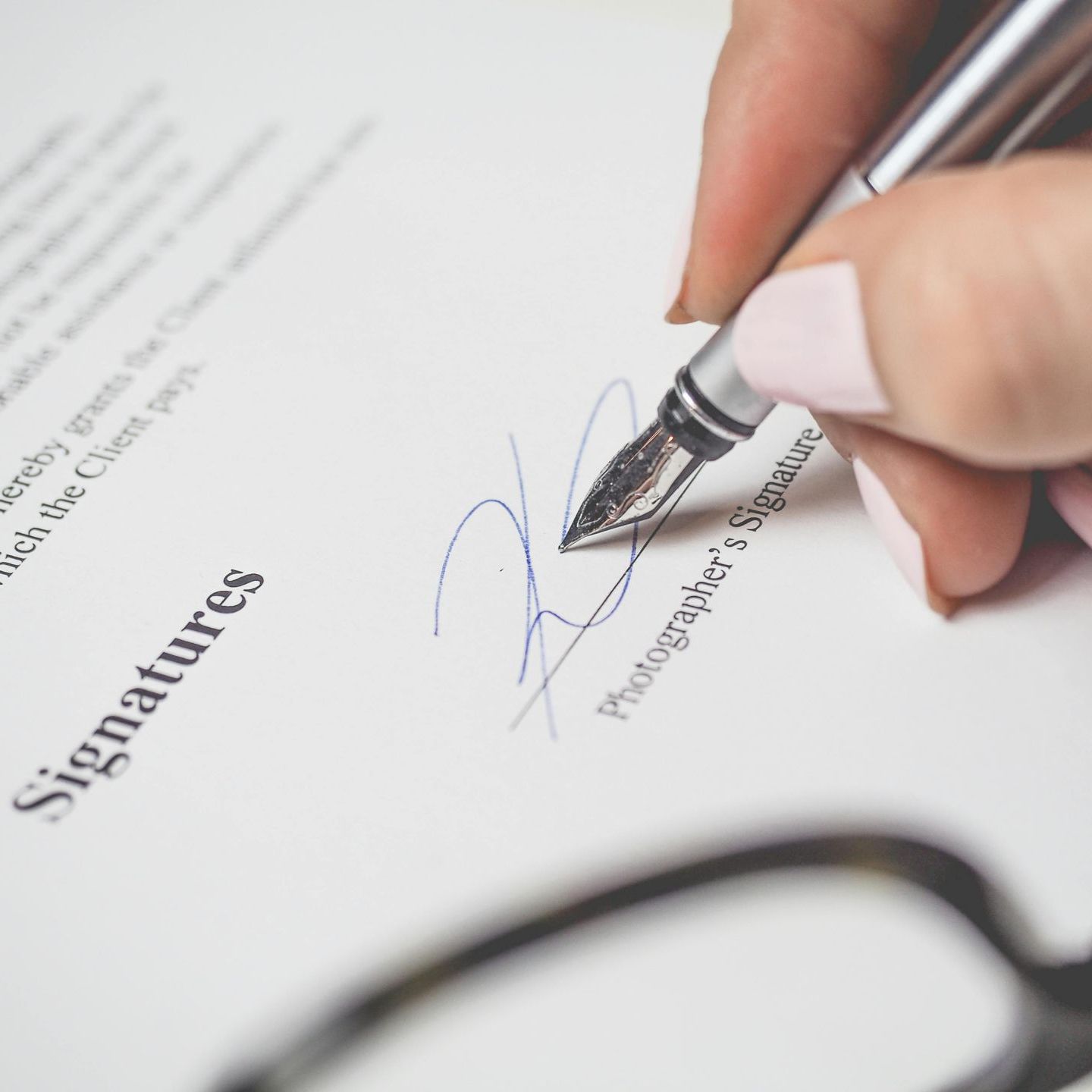 Pen signing new job contract. Professional CV writing services from a certified, UK-based writer | CV Shed.