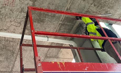 a concrete scanning expert on a scissor lift