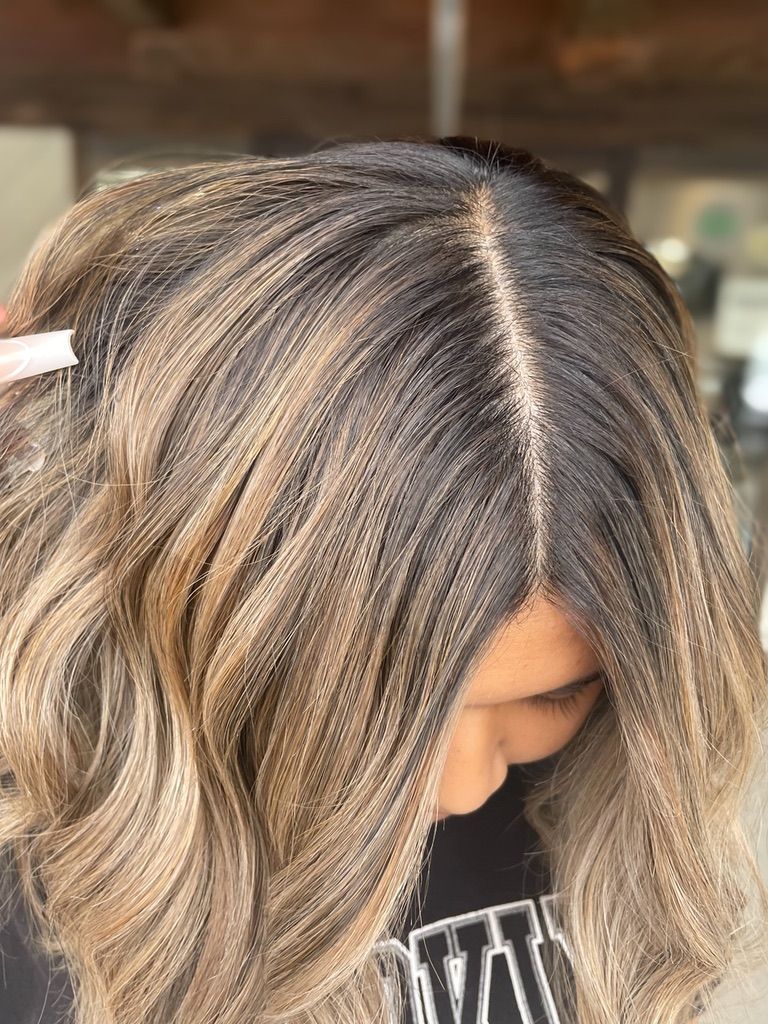 A close up of a woman 's hair with a comb in it.