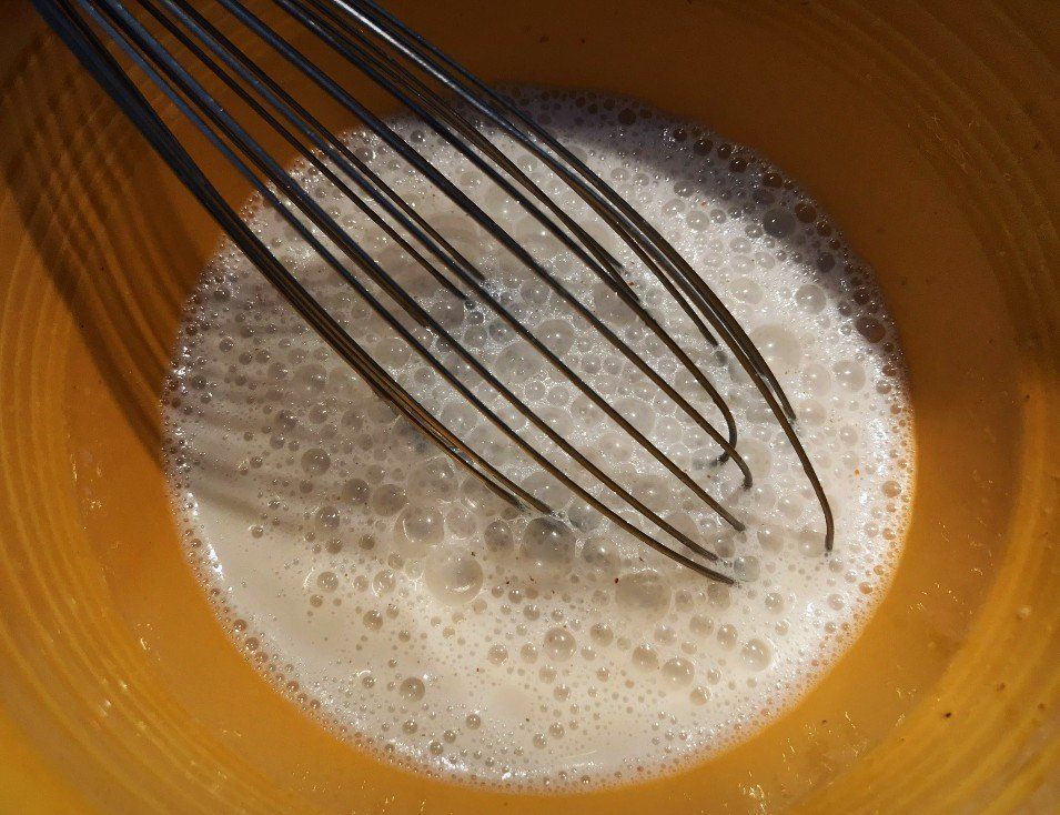 wet ingredients being combined in bowl