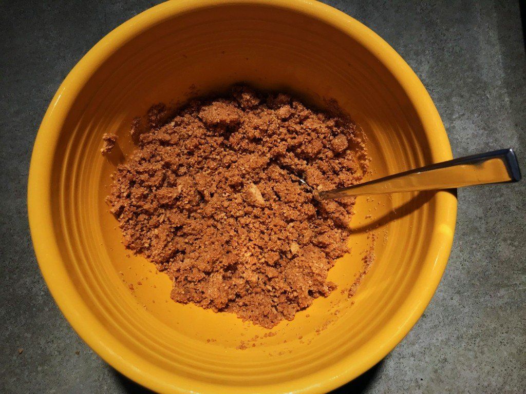 graham cracker crust mixed in bowl
