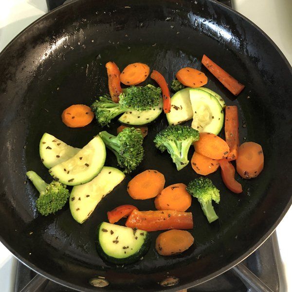 vegetables sautéing in pan