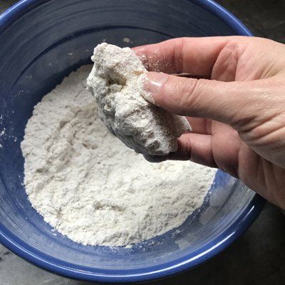 dipping tofu in dry ingredients